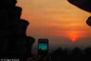 Visitors at the view terraces of Angkor Wat strive in the intense crowds to get a good shot of the stunning sunset