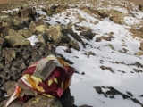 A scarf covering the summit cairn.