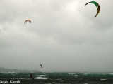 It is fun to watch colorful kitesurfers