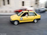 Dynamic traffic of Damascus is identified with its yellow cabs.